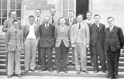 Front row, left to right: R.G. Wade, F. Parr, W. Winter, R.F. Combe, C.H.O'D. Alexander, H. Golombek, G. Abrahams Behind: G. Wood, R.J. Broadbent,