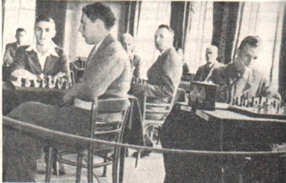 The 1938 British Championships at Brighton. L to R: Golombek; Frank Parr (tieless) ; C. H. O'D. Alexander; Sir George Thomas (partly hidden), Milner-Barry; E. G. Sergeant & A. Lenton.