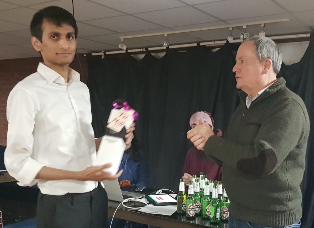 Midhun collecting his prize