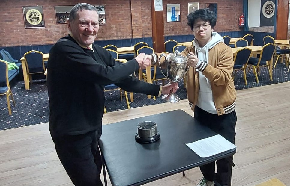 Arnold Hunt presenting the Handicap Cup trophy to Son Tung Nguyen